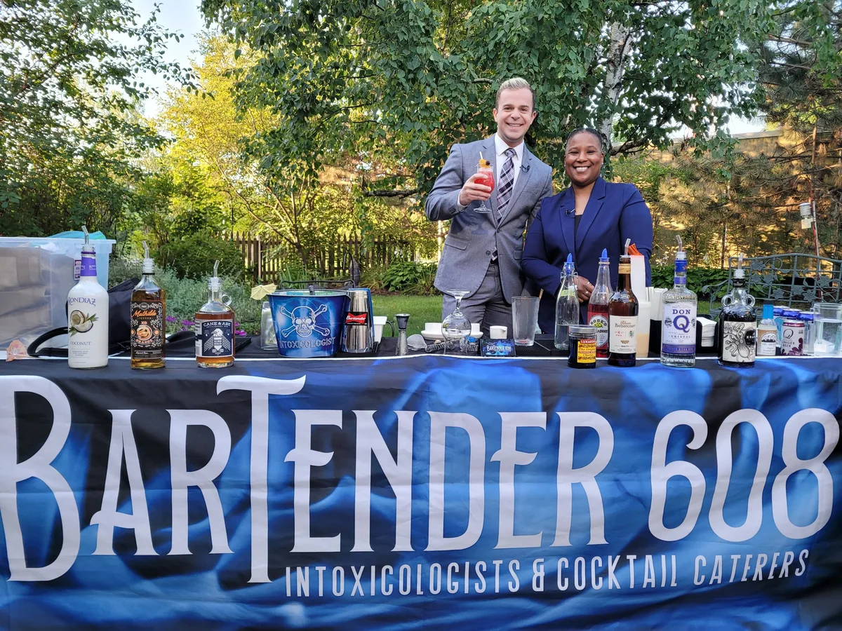 China Moon and the News 3 Now host behind the Bartender 608 bar for National Rum Day